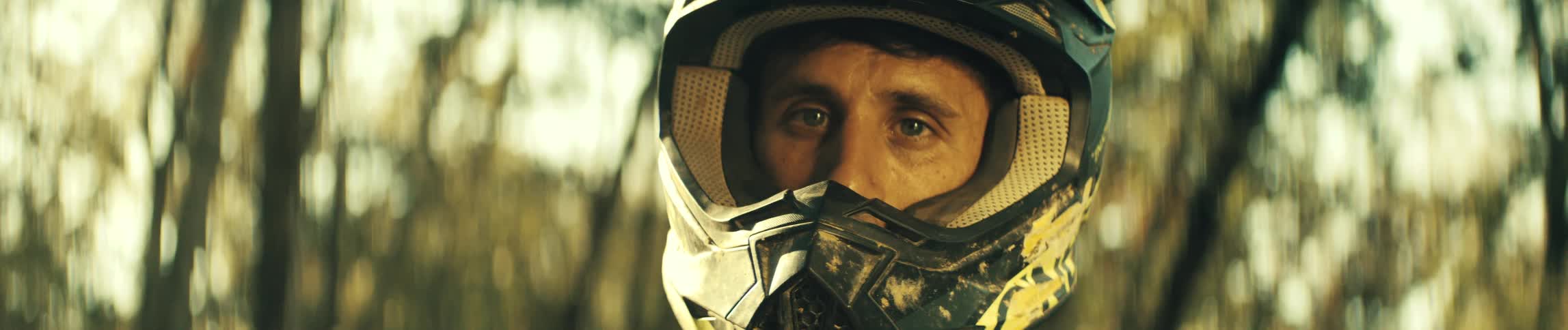 A man outdoors with a helmet on