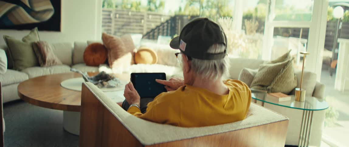 A person using a tablet in a room
