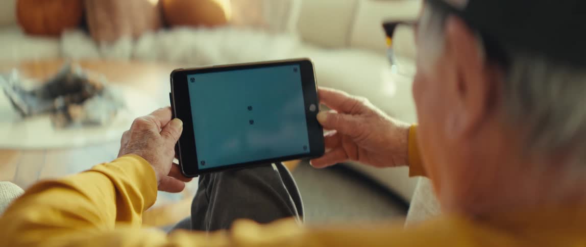 A man using a tablet in a room