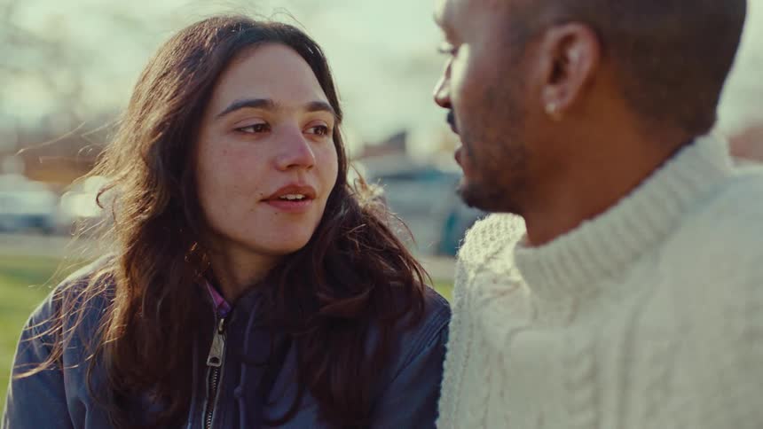 A couple talking outside