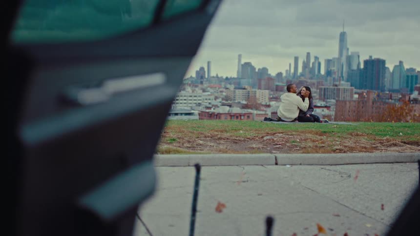 A man and woman sitting outdoors