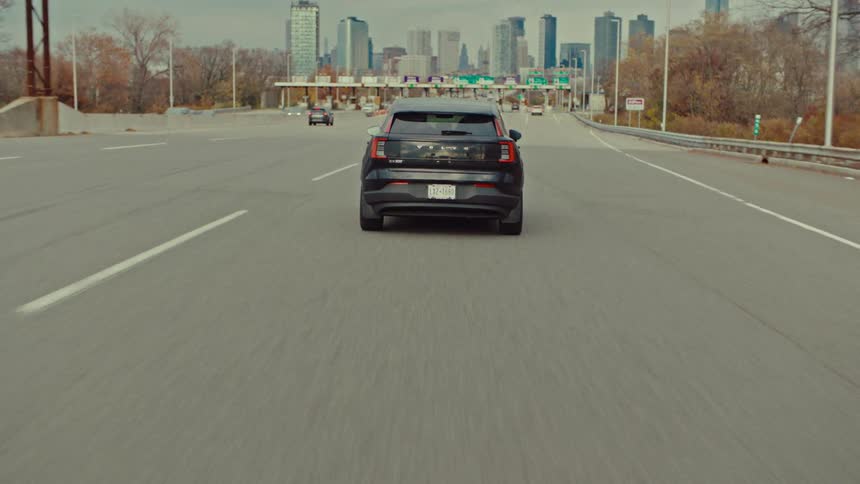 A car driving towards a toll road