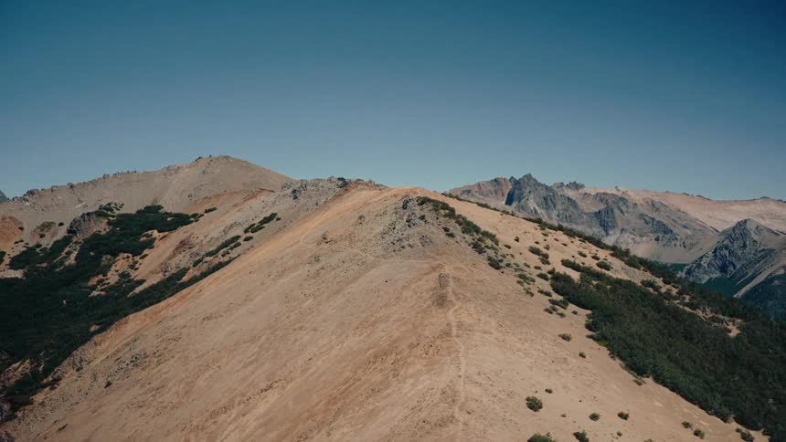 The ridge line of a mountain on a sunny summer day