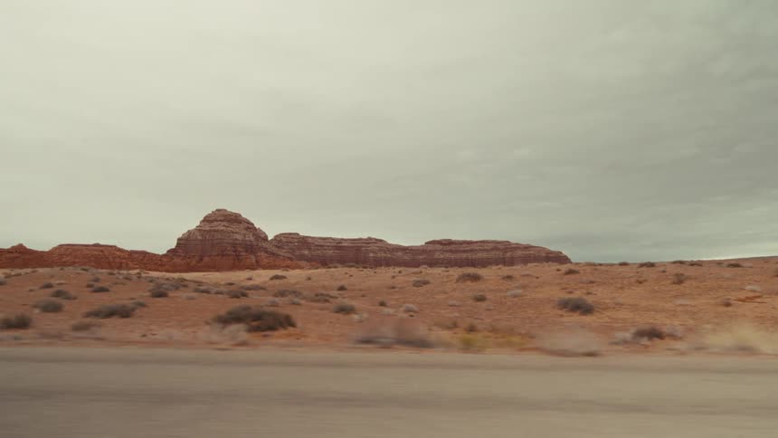 A road trip through the wilderness with dry land at midday