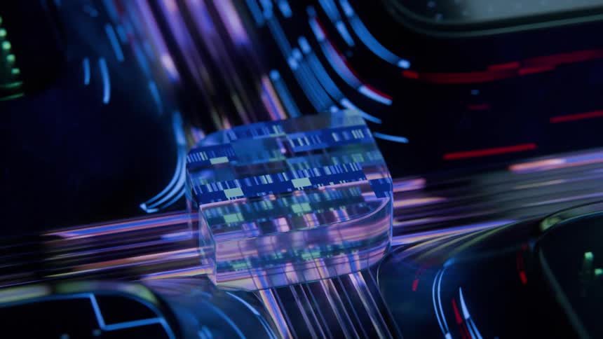 A translucent cube with a digital pattern sits in the center of a dark futuristic environment streaks of blue and red light move rapidly around the cube suggesting motion and data flow