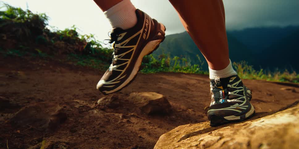 A persons foot running outdoors