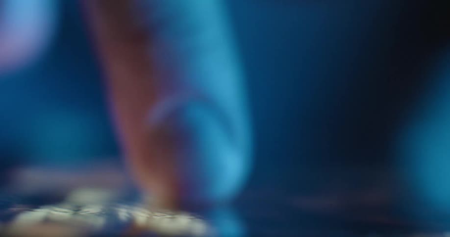 Finger pressing an illuminated touchscreen