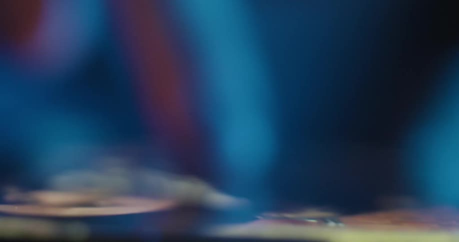 A close up of a finger scrolling on smart phone with a lot of blur in the foreground
