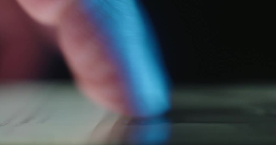 Closeup of an adult finger scrolling on a smartphone