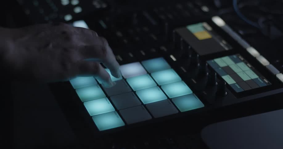 Woman uses a keypad on a piece of audio equipment