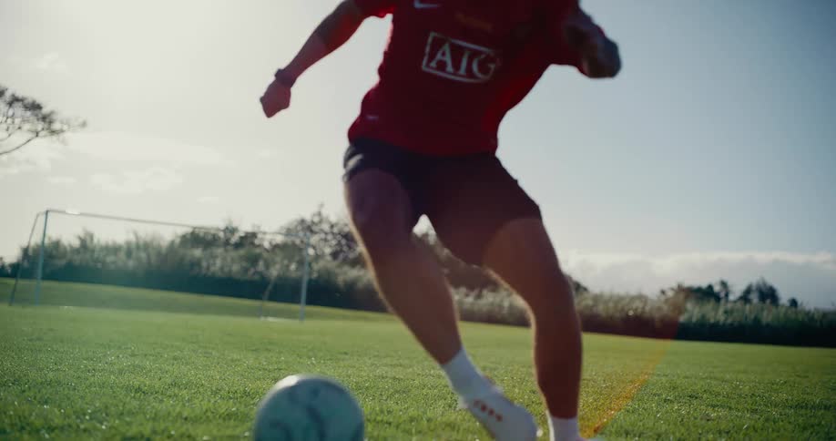 A man playing soccer on a field