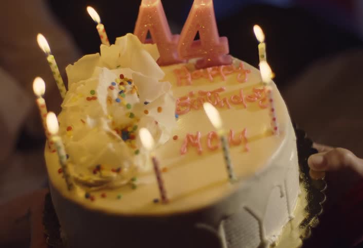 A close up of a cake with candles on it