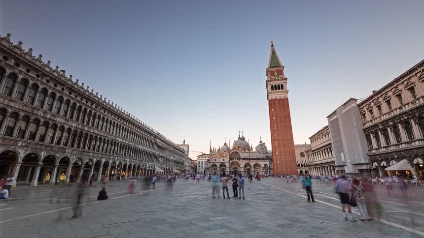 Many people walk around a landmark site