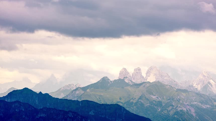 A storm moves over a mountain range