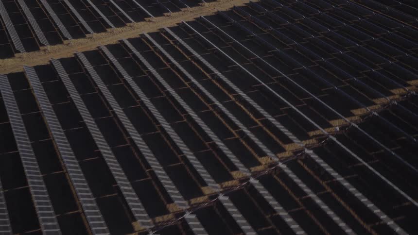 Solar panels on a solar farm lined up across the land