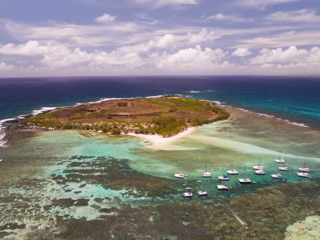 Clouds flow towards the small island