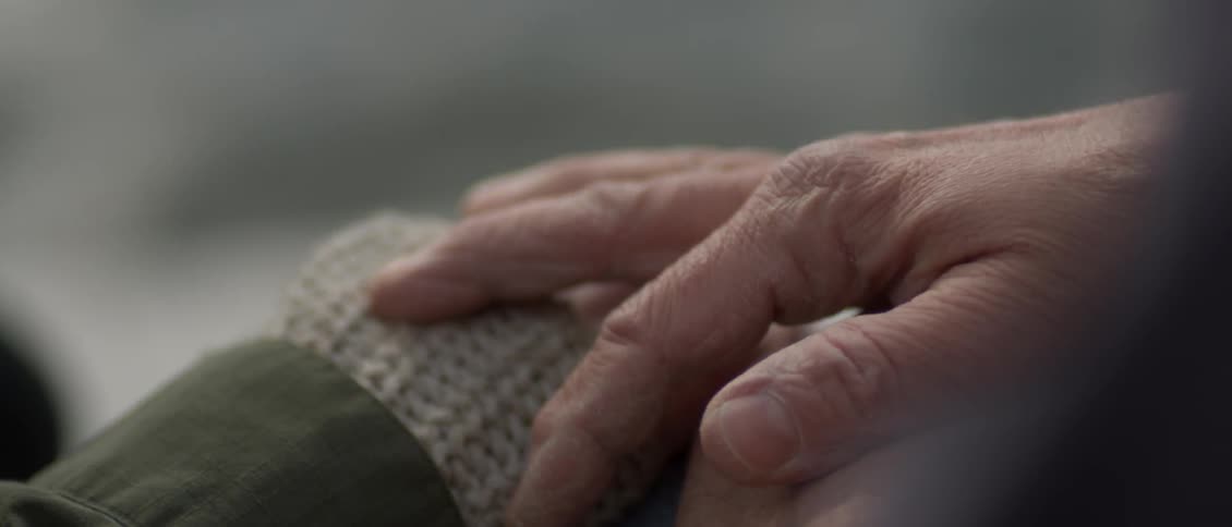 A man puts his hand on a woman's