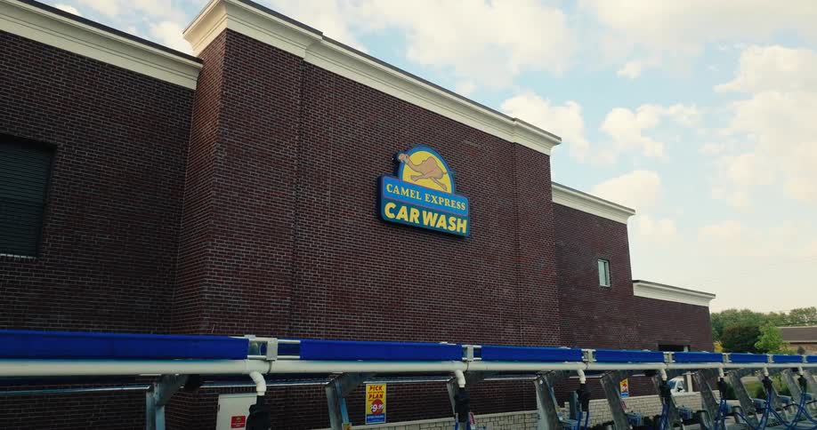 The exterior of a car wash in a city