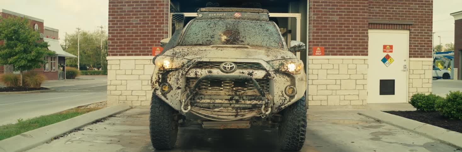 A car driving out of a carwash