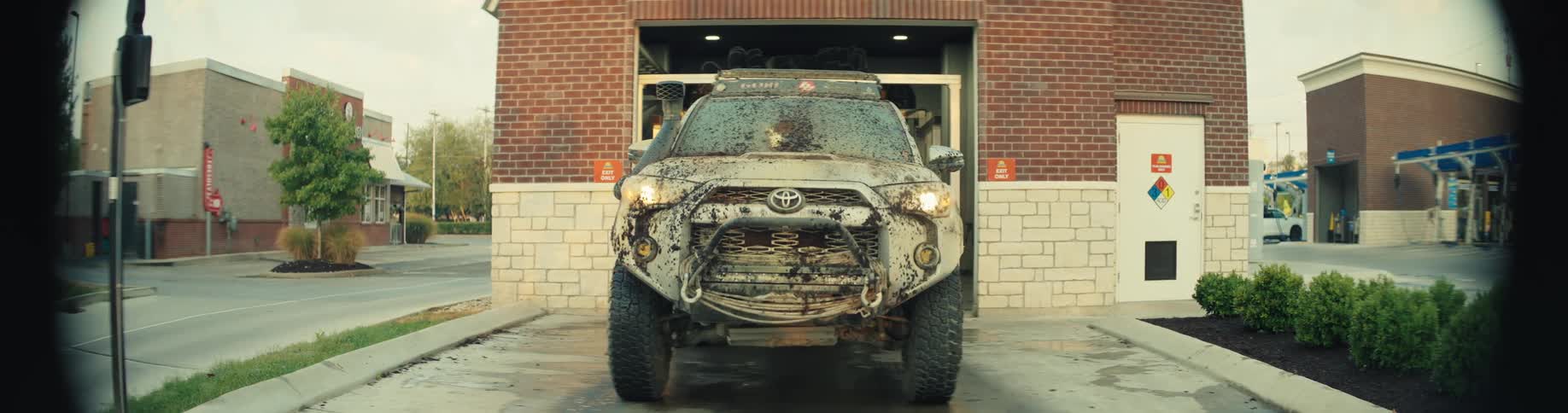 Vehicle exiting an automatic car wash