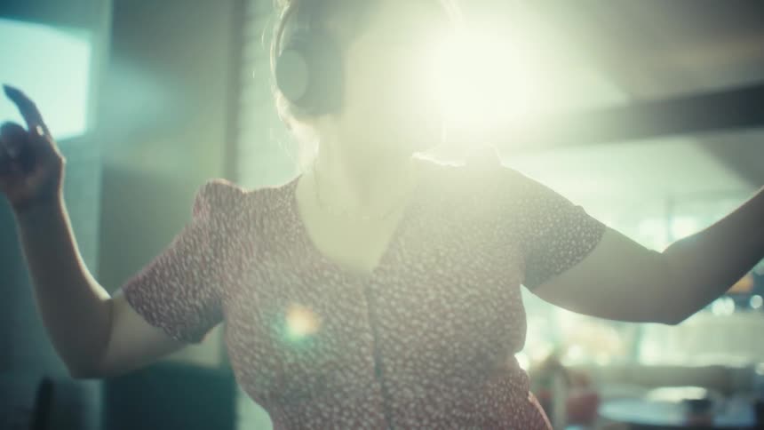 Woman dancing with headphones