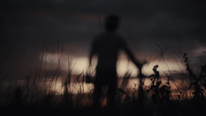 Cyclist silhouette with bicycle at sunset