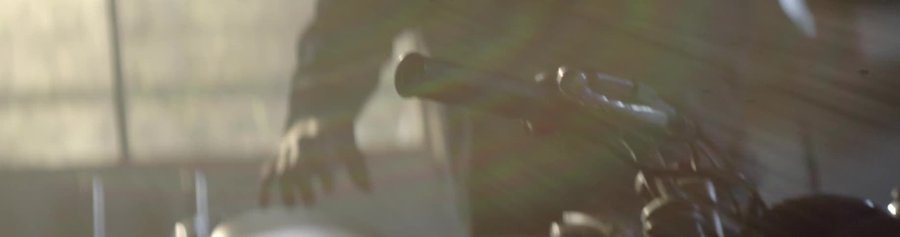 Person grabs handlebar of a bike
