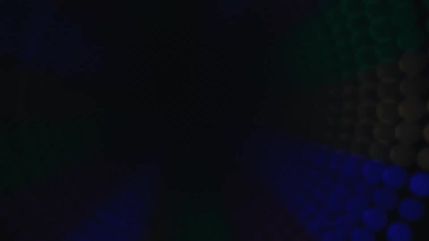 Colored luminous dots form a circular pattern on a dark background