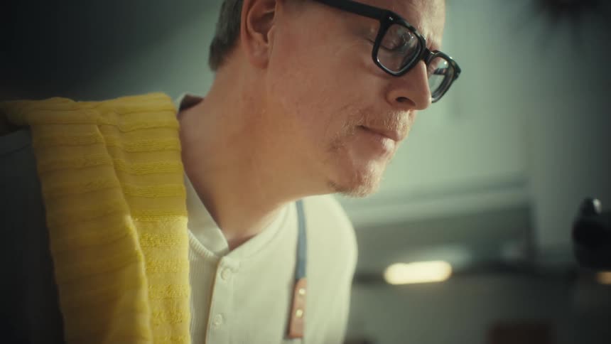 A man baking food with a mixer