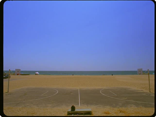A basketball court on a beach