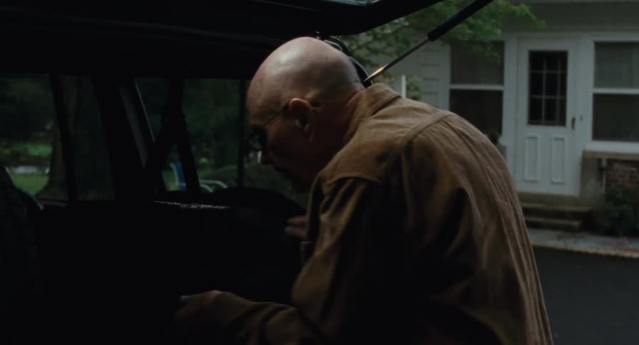 Man removes a drum from his trunk