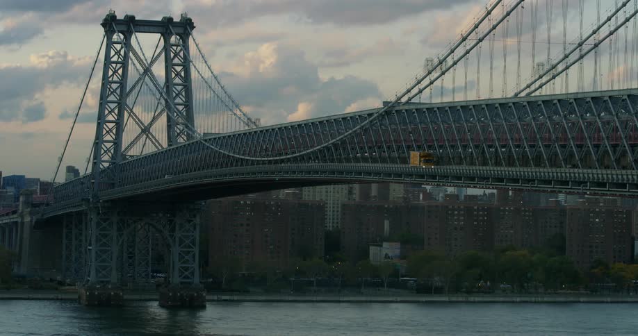 Traffic moves across a large suspension bridge