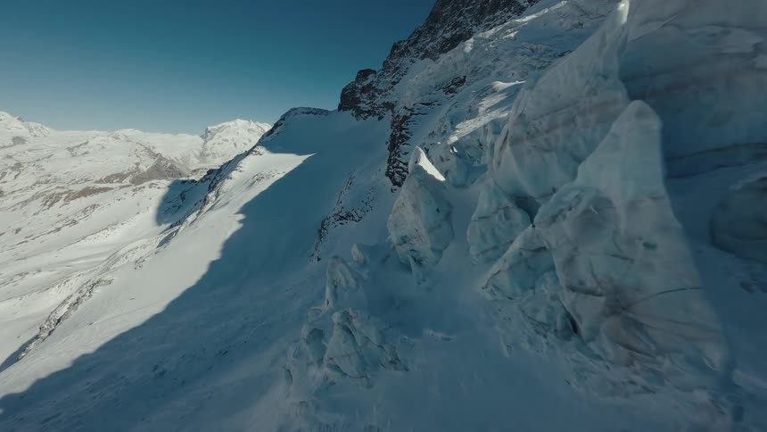 Snowcovered mountain landscape with glacial crevasses