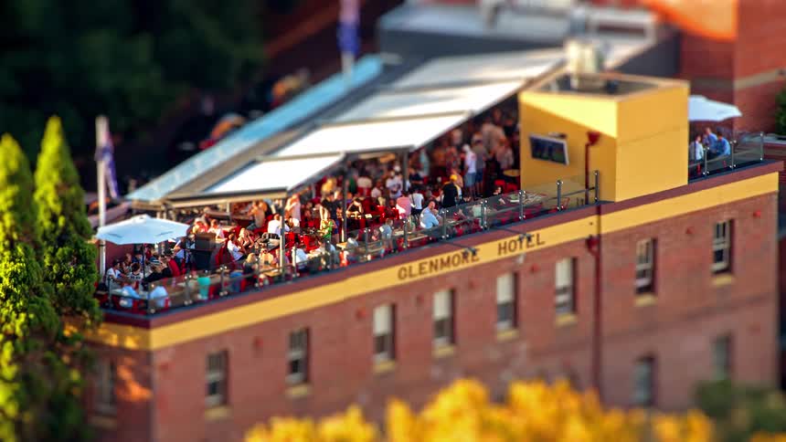 A time lapse of people outdoors on a patio