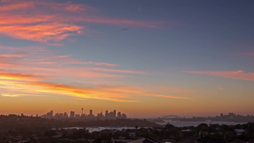 A time lapse of the sun setting over a city
