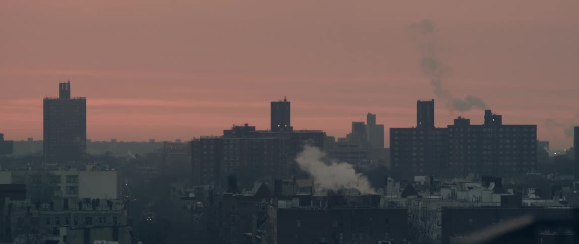 View of the tops of buildings in a cloudy city