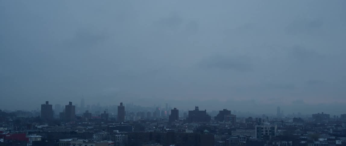 A very cloudy sky over a city