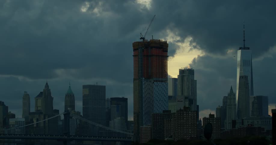 Clouds float over city skyscrapers