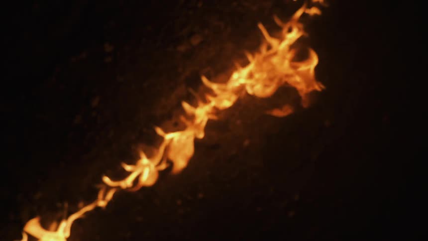Fire burning brightly on the ground