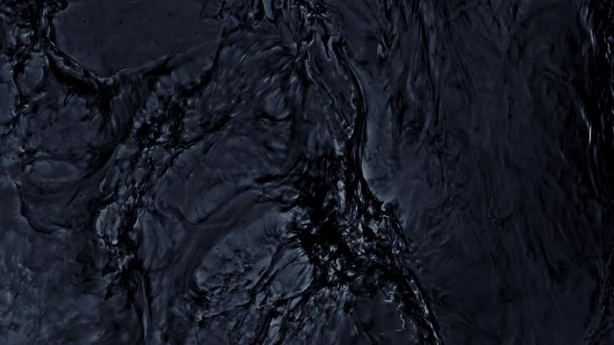 A dark, viscous liquid slowly swirls and forms abstract organic patterns