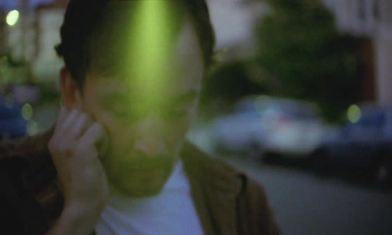 Anxious man stumbles down the street