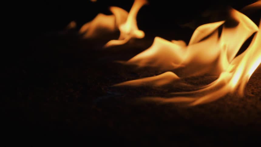 Flames burn on the ground