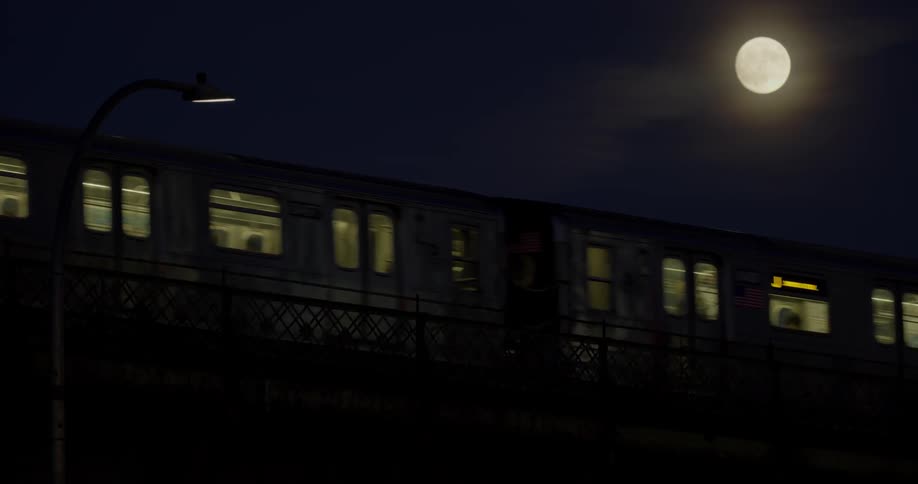 Train going past the moon at night