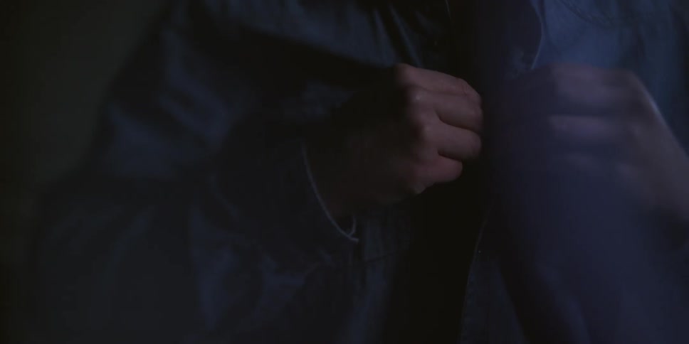 Man buttons his coat