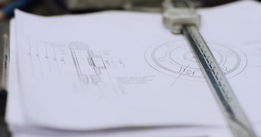 Blueprints are sitting on a table