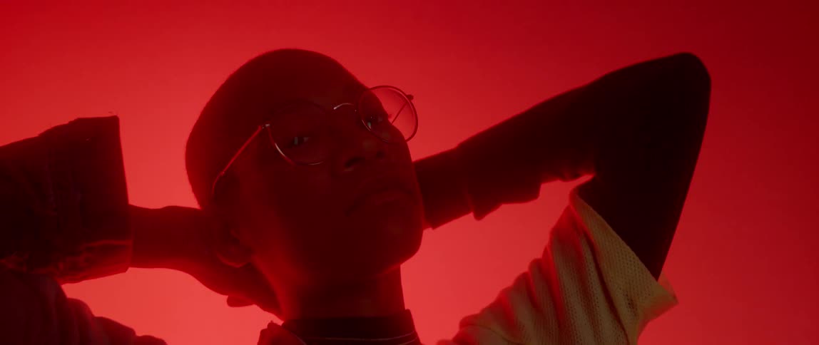 A person is shown with glowing red lights all around