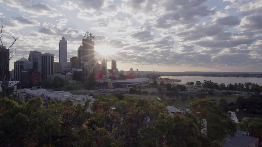 The sun is rising over the city