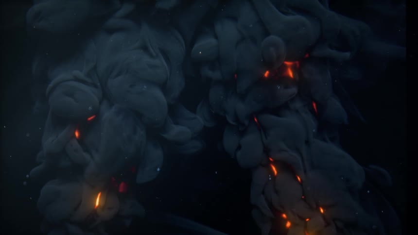 Billowing clouds of dark smoke glow from within with fiery embers in a mysterious abstract animation