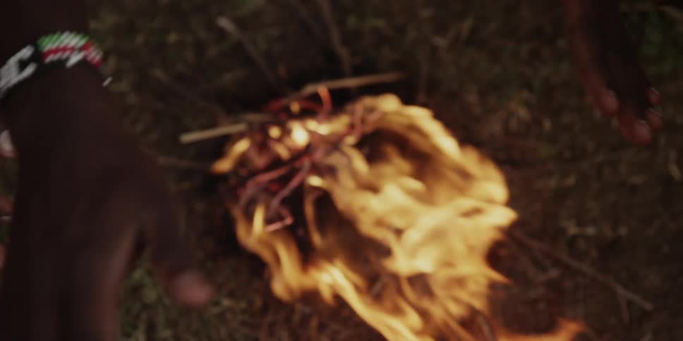 Hands over a fire