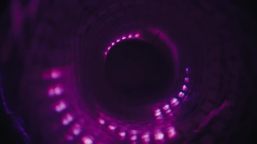 A mesmerizing journey through a spiraling, abstract tunnel illuminated by pulsing, colorful neon lights